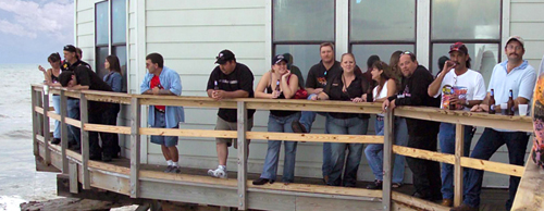 Group of people hanging around outside on the deck